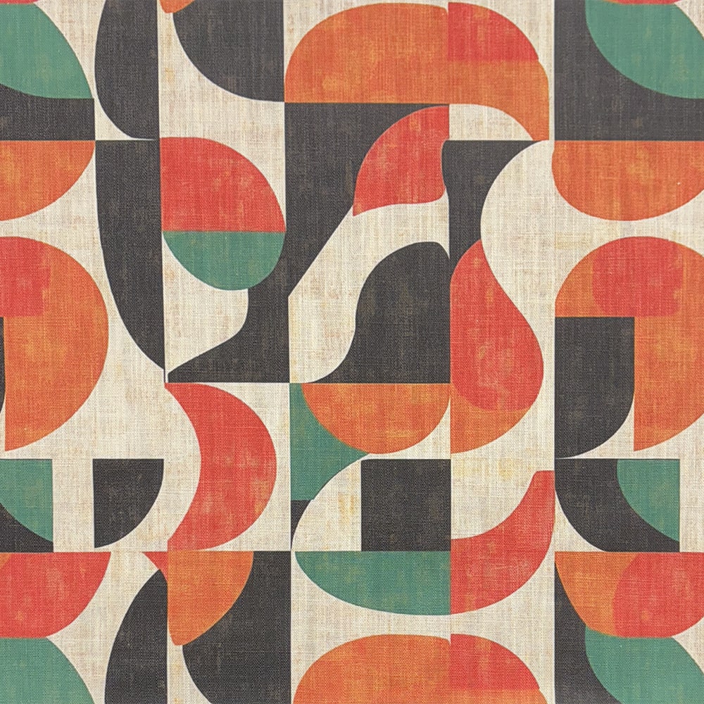 A cubist-inspired designer upholstery fabric featuring bold geometric shapes in black, burnt orange, red, and deep green.