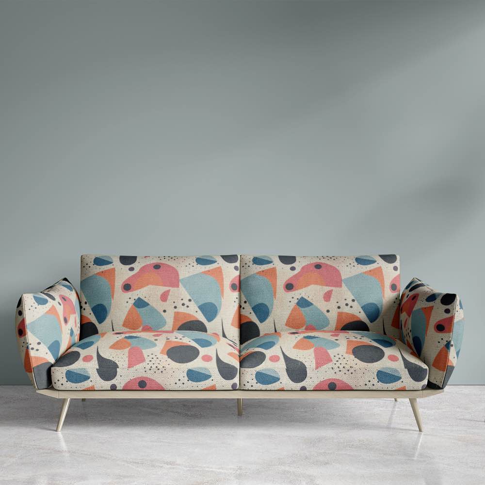 Sofa view of Abstract No.9 upholstery fabric with neutral tones and colorful abstract circles