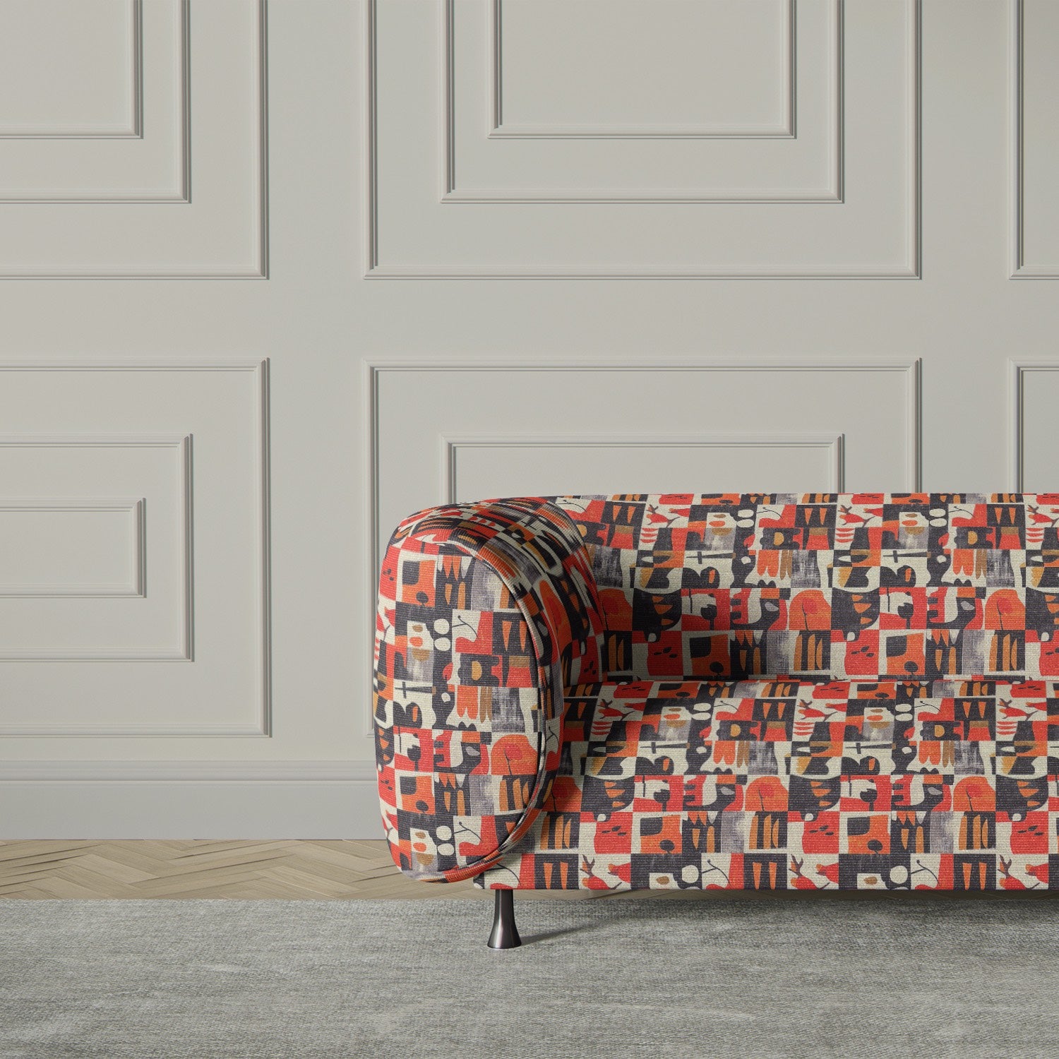 Luxury sofa upholstered in Atelier No.1 fabric, featuring geometric abstract patterns in bold terracotta, black, and gold hues for a modern statement piece.