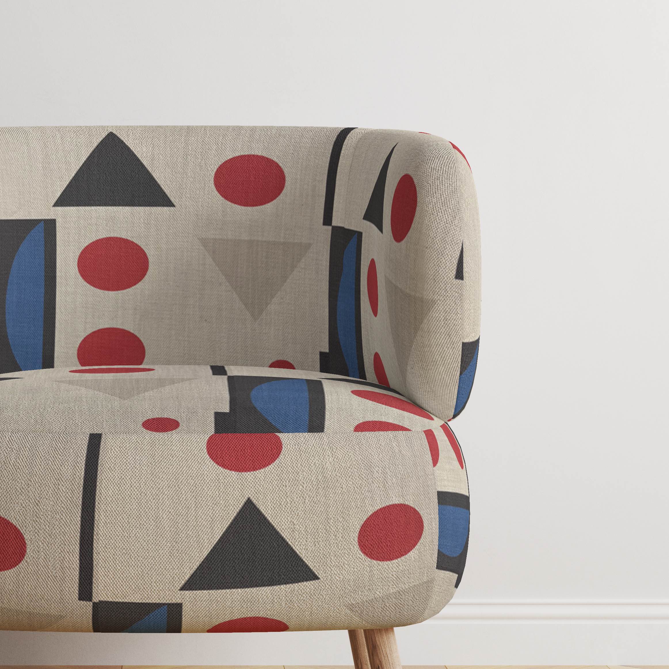 Ruffled view of Avignon No.3 upholstery fabric in natural with black, red, and blue with cubism shapes