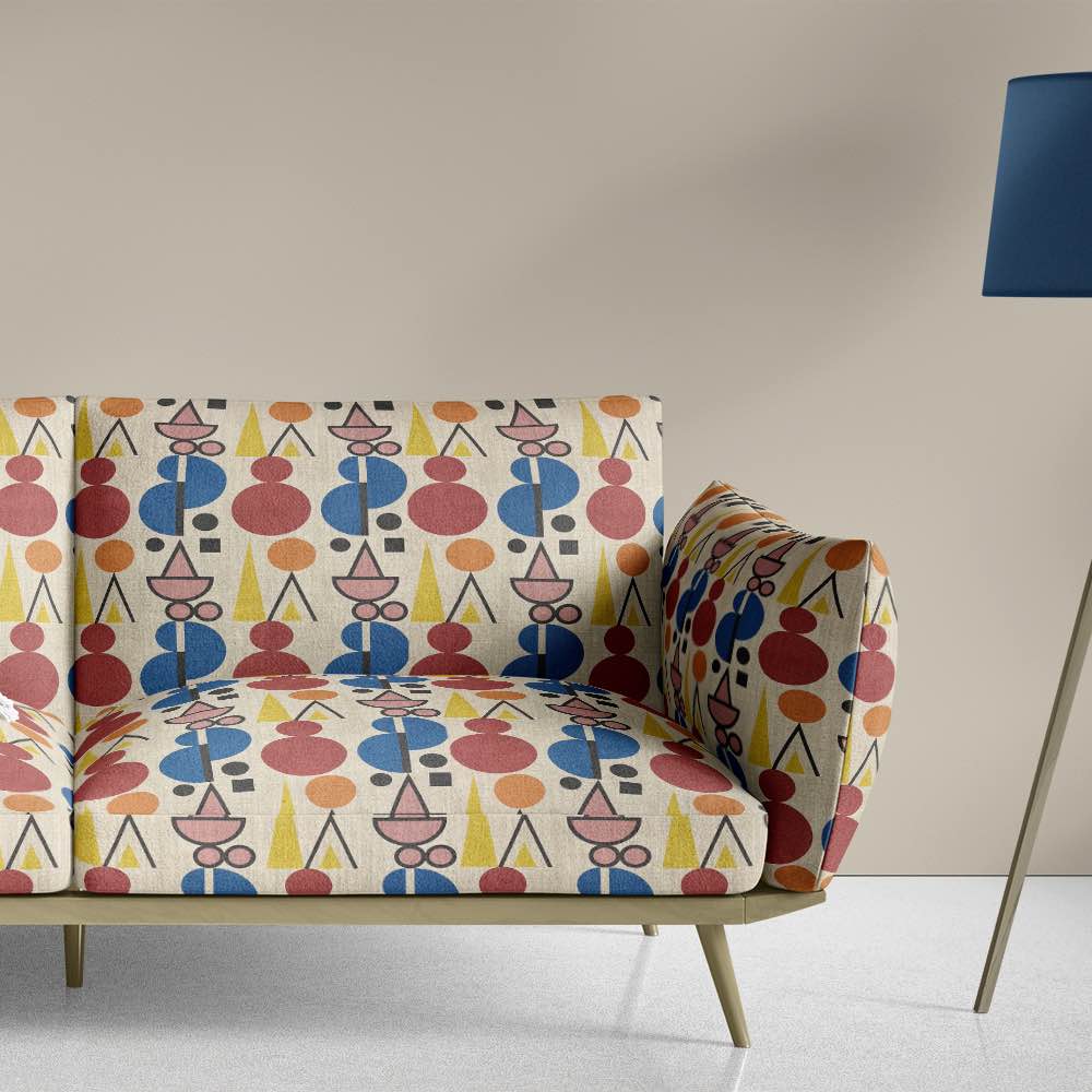 Sofa view of Avignon No.5 upholstery fabric in multicoloured bright and bold with cubism shapes