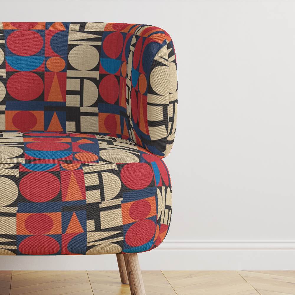 Chair view of Avignon No.7 upholstery fabric in multicoloured bright and bold with cubism shapes