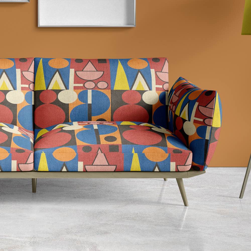 Upholstered view of Avignon No.9 upholstery fabric in multicoloured bright and bold with cubism shapes