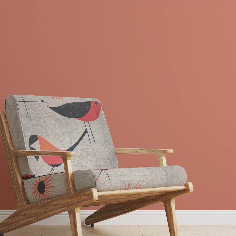 Chair of Bird No.19 upholstery fabric in red and orange palette with abstract bird design