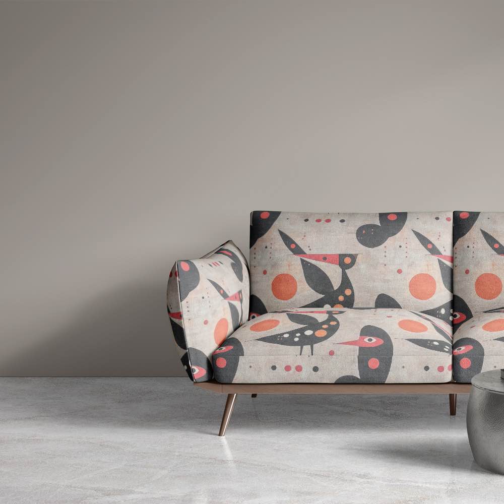 Sofa view of Bird No.9 upholstery fabric in neutral palette with abstract bird design