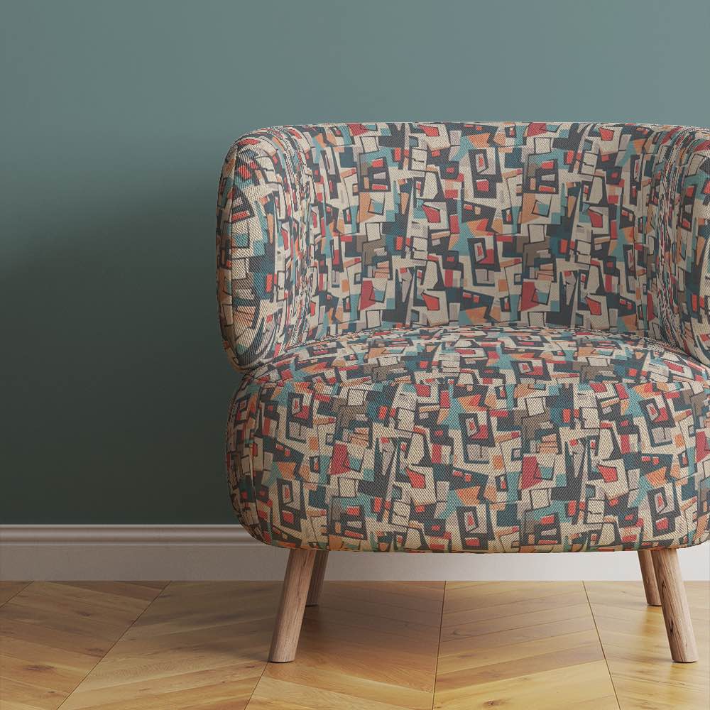 Chair view of Collage No.3 upholstery fabric in multicoloured with natural tones and overlapping collage pattern