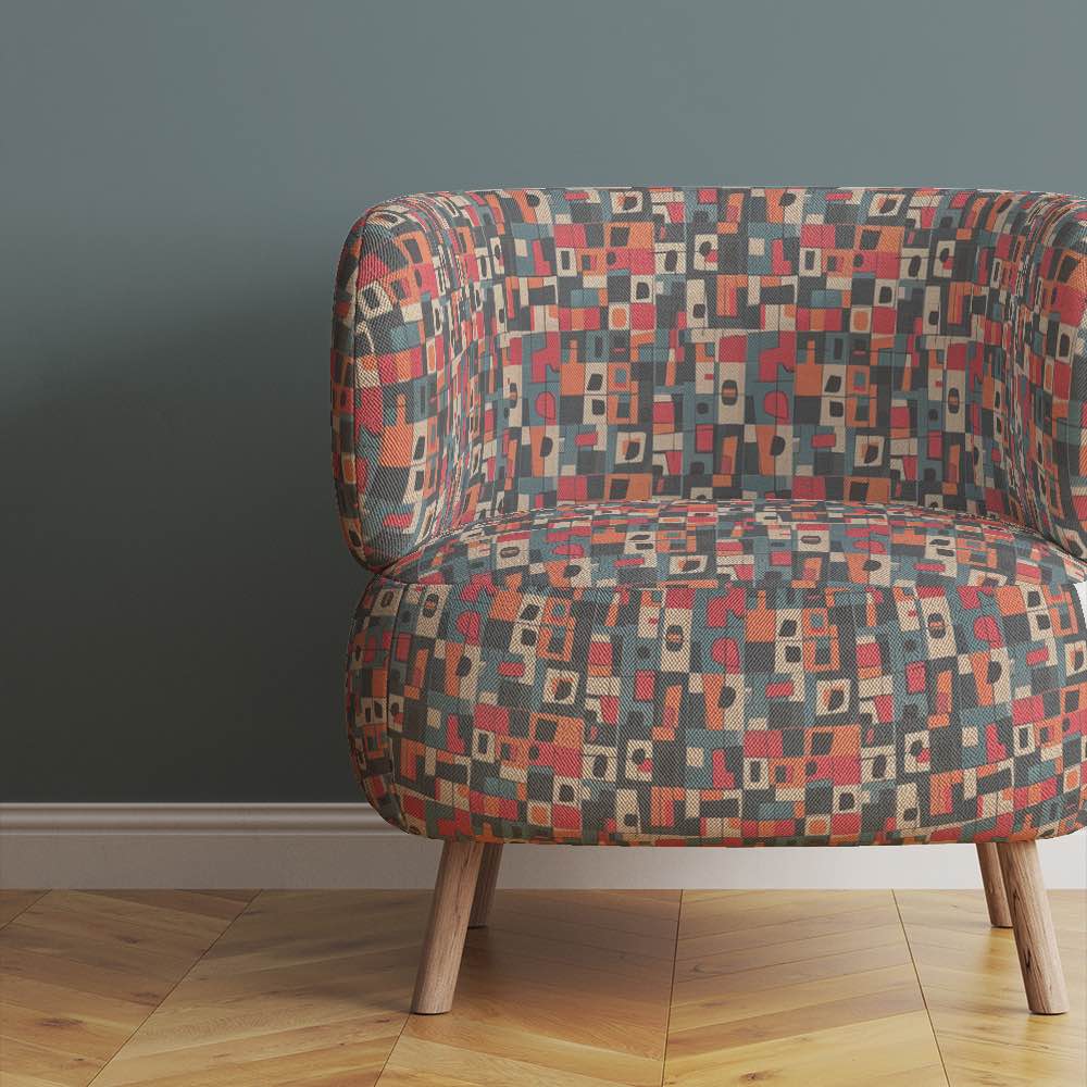 Upholstered Chair of Collage No.6 upholstery fabric in red, orange, and blue with overlapping collage pattern