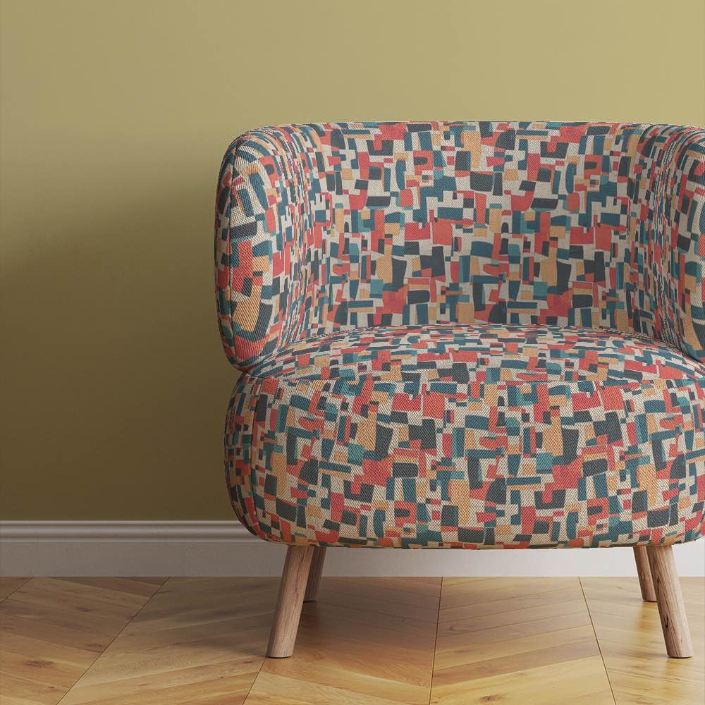 Chair view of Collage No.8 upholstery fabric in multicoloured with natural tones and overlapping collage pattern