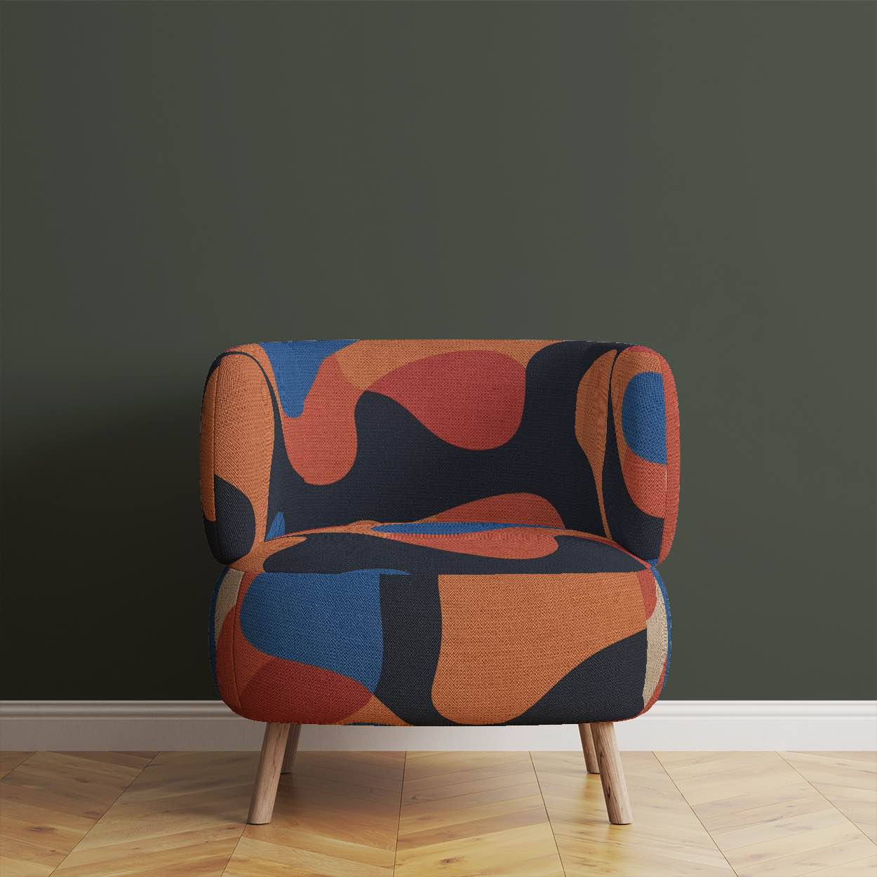 Upholstered Chair of Creation No.1 upholstery fabric in orange and blue with abstract overlapping shapes