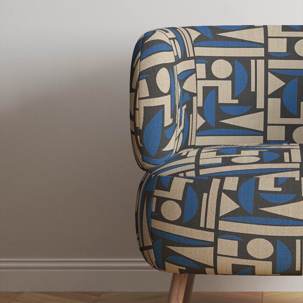 Upholstered view of Cubism No.7 upholstery fabric in blue, black, and neutral with Cubism art movement design