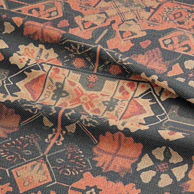 Ruffled view of Kilim No.12 upholstery fabric in autumnal colour palette with Kilim pattern