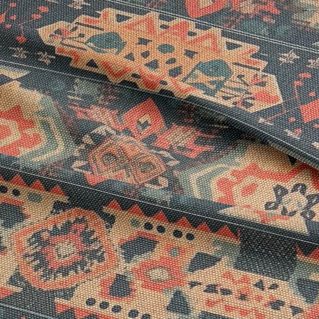 Ruffled view of Kilim No.7 upholstery fabric with autumnal colour palette and Kilim pattern