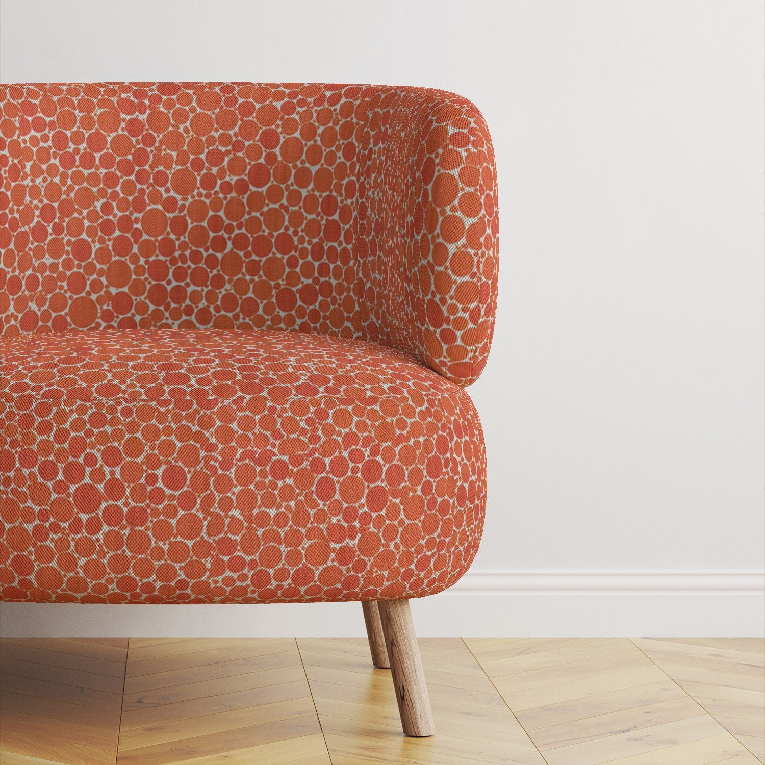 Modern upholstered Chair covered in Pointillia No.1 fabric, showcasing its rich texture and bold circular design.