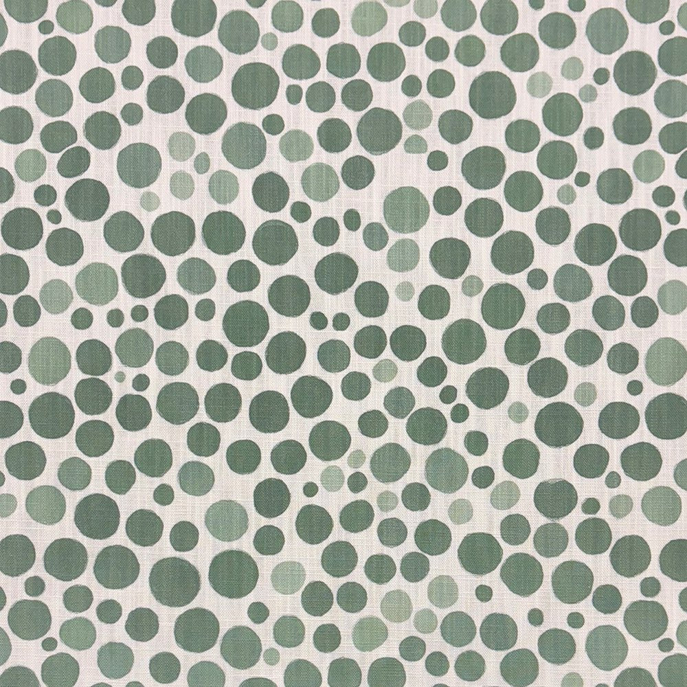 Close-up of Pointillia No.3 printed upholstery fabric featuring organic green dot formations on a linen-blend weave.