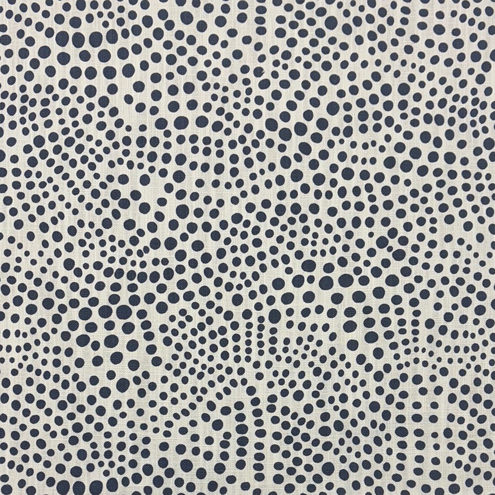 Close-up of Pointillia No.6 printed upholstery fabric featuring abstract navy dot patterns on a linen-blend weave.