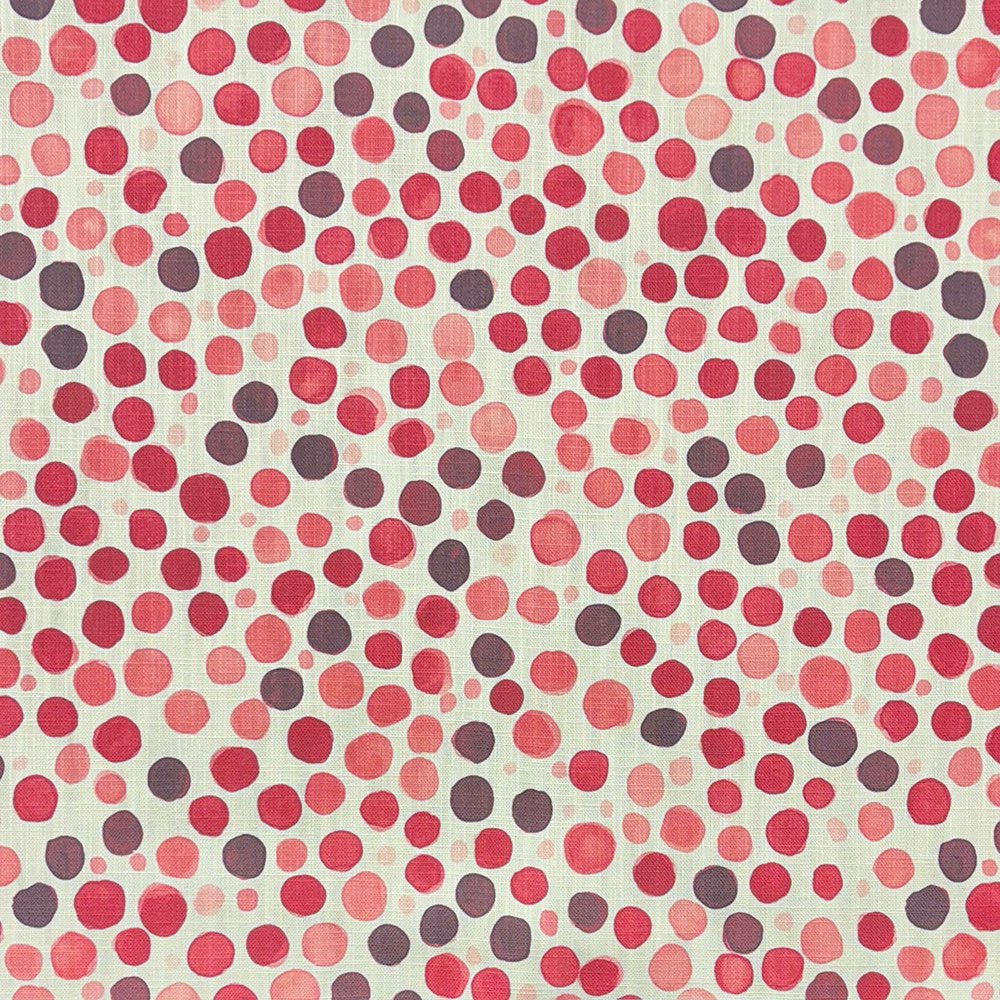 Close-up of Pointillia No.7 printed upholstery fabric featuring pink, coral, and plum dot formations on a linen-blend weave.