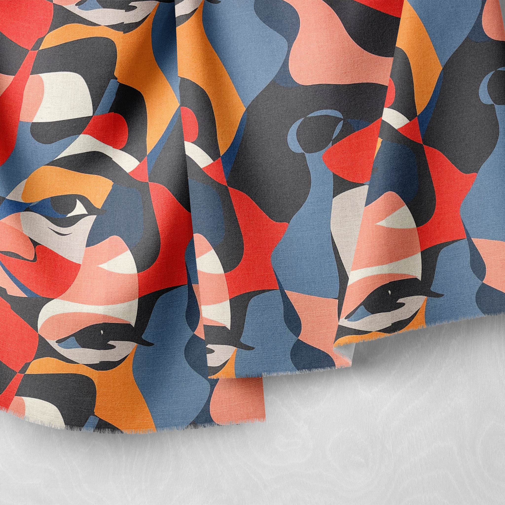 Draped Sculpture No.10 luxury upholstery fabric featuring a vibrant abstract face design in red, blue, and orange hues.