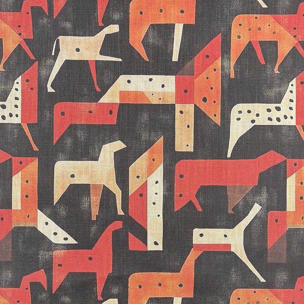 A striking designer upholstery fabric featuring an abstract geometric dog pattern in red, beige, and black.