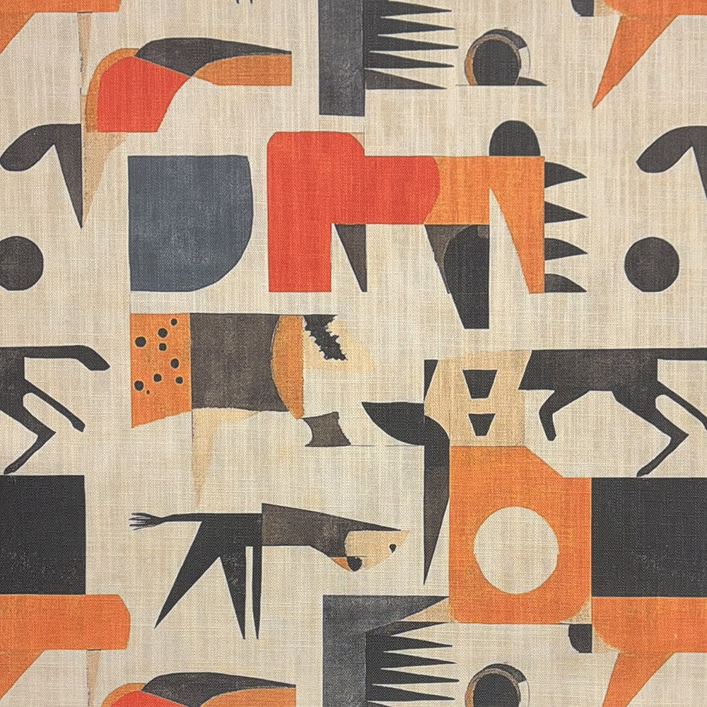 A modern designer upholstery fabric featuring an abstract geometric pattern in warm beige, charcoal, and burnt orange.